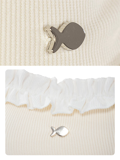 Fish-shaped buttons on a textured fabric background