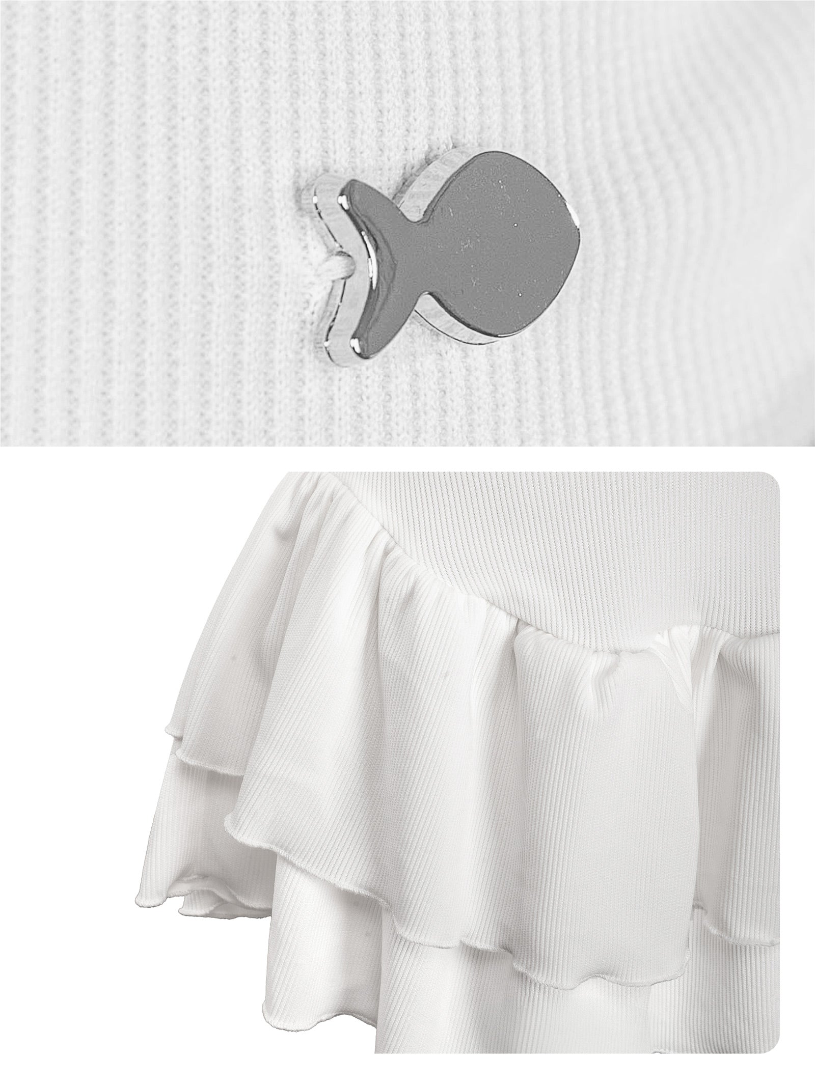 Close-up of a white sweater with a gray fish-shaped button and a white skirt with ruffles.