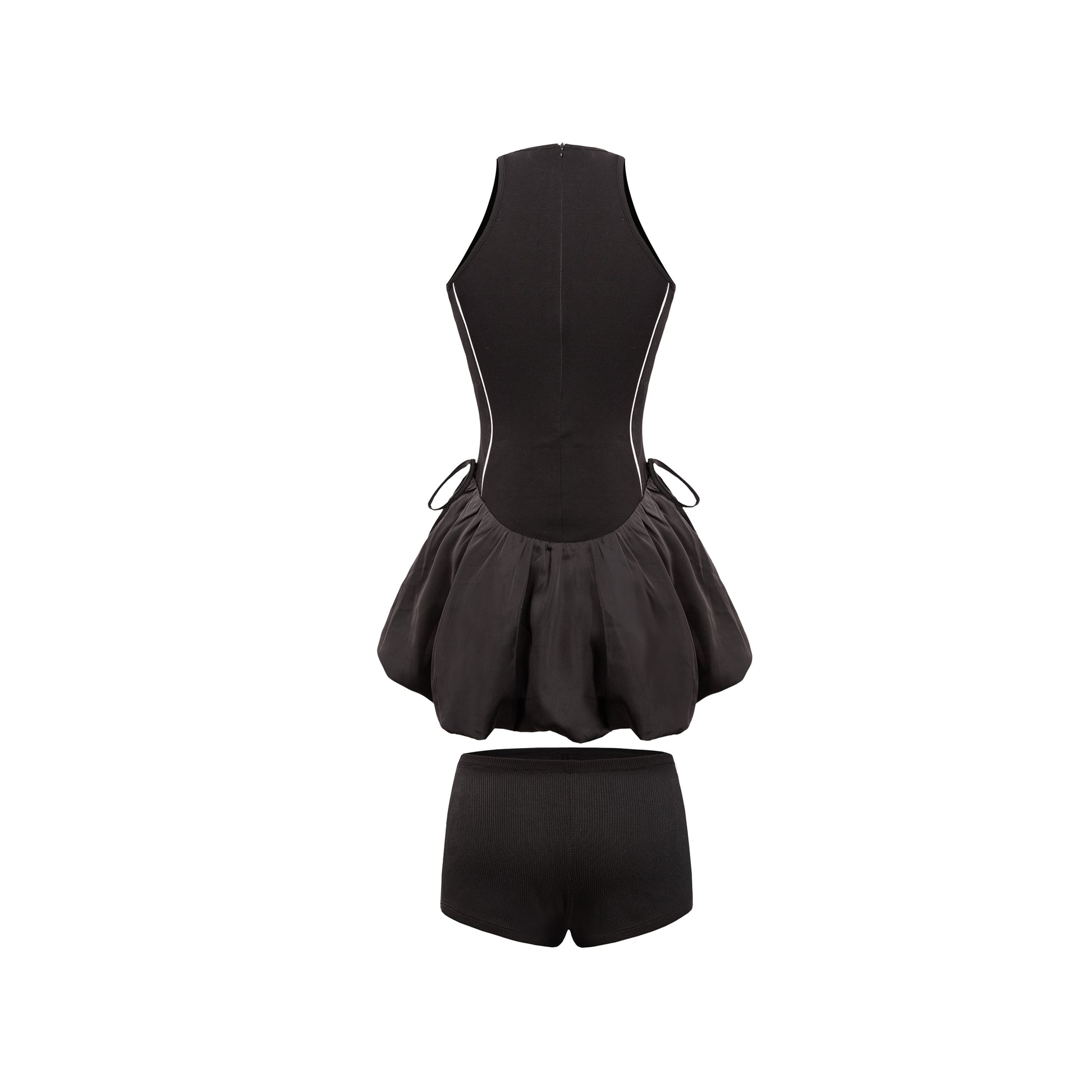 Black swimsuit with a peplum top and shorts on a white background