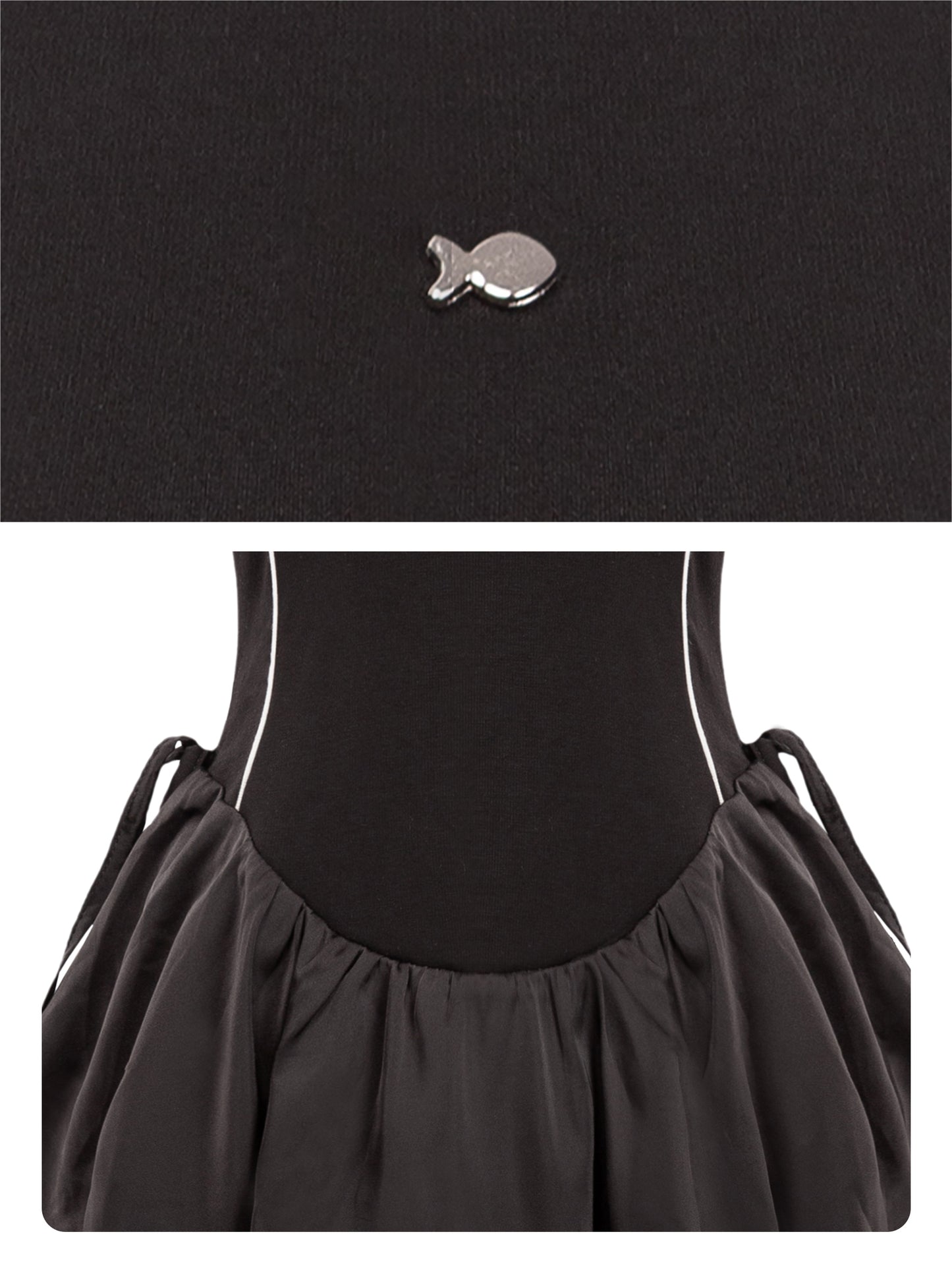 Black dress with a fish-shaped brooch on a white background
