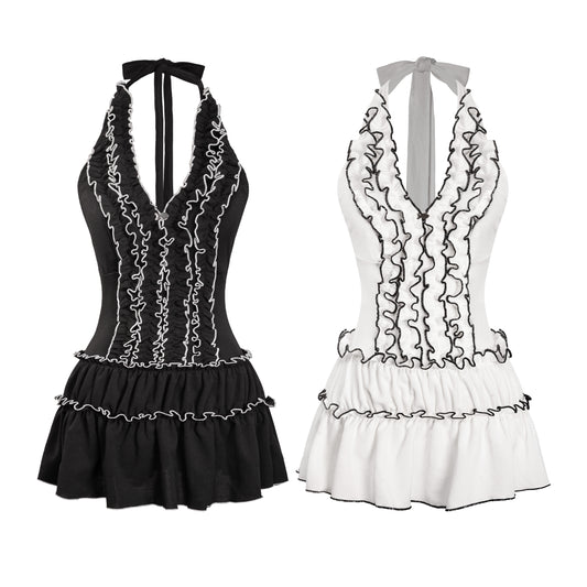 Two black and white halter neck dresses with ruffled details on a white background.