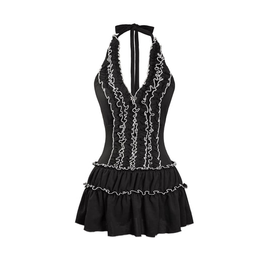 Black dress with white lace details on a white background