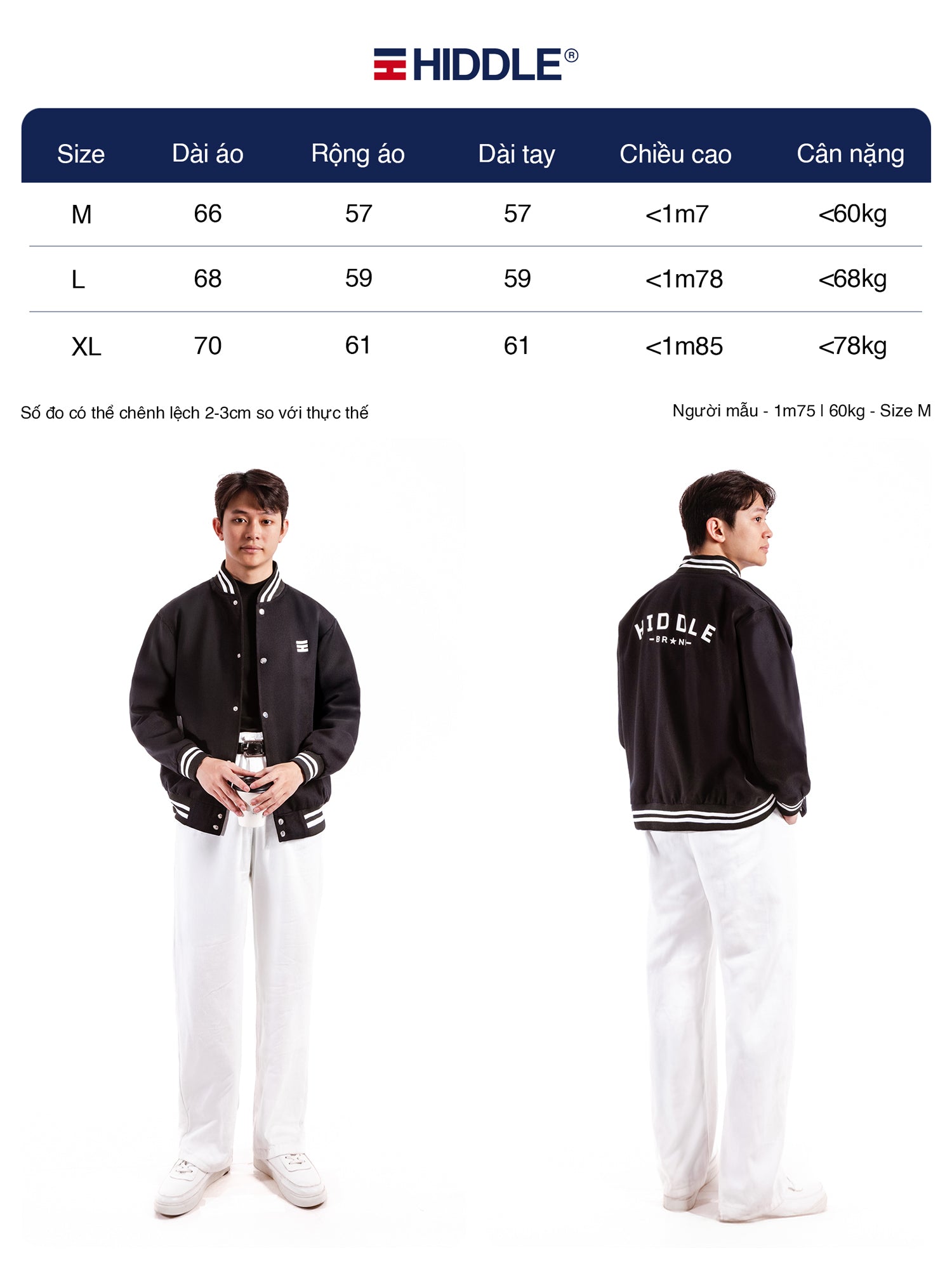 Person wearing a black varsity jacket with Hiddle branding, standing next to a size chart.