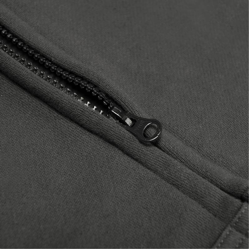 Close-up of a zipper on a gray fabric background