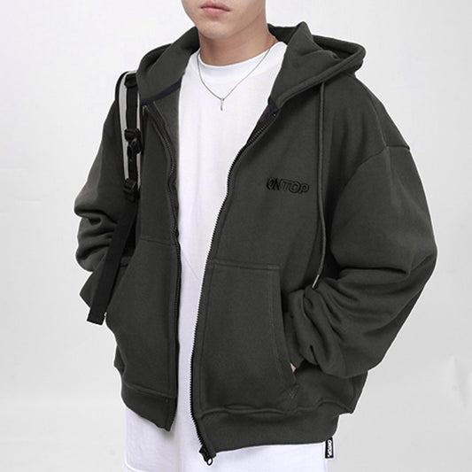 Person wearing a black hoodie with a brand logo on a white background