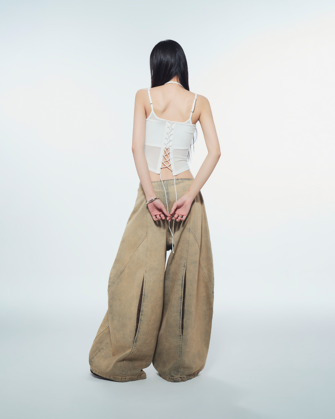 Melios Top styled with bralette and trousers – minimalist outfit idea