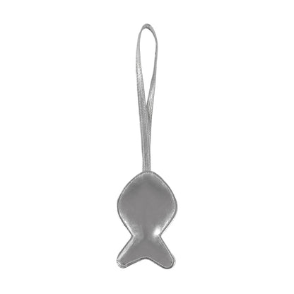 Silver fish-shaped object with a string on a white background