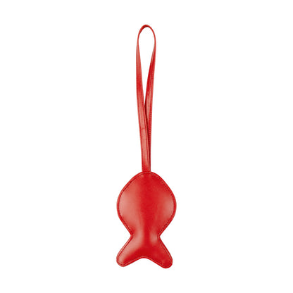 Red fish-shaped object with a handle on a white background