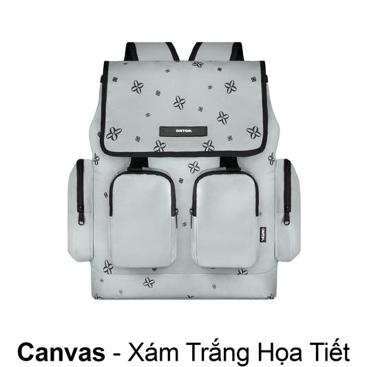 White backpack with black floral patterns on a white background