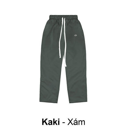 Kaki pants with drawstring on a white background