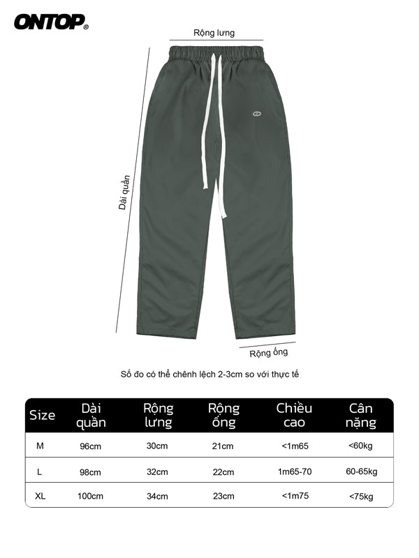 Green pants with size chart on a white background
