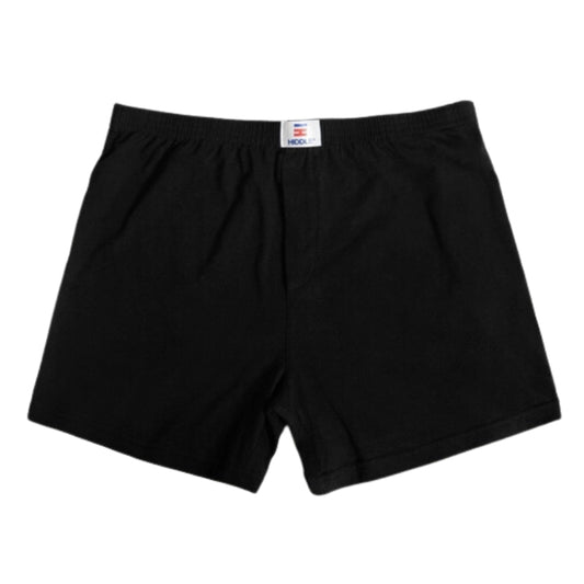 Black shorts with a visible brand label on a white background