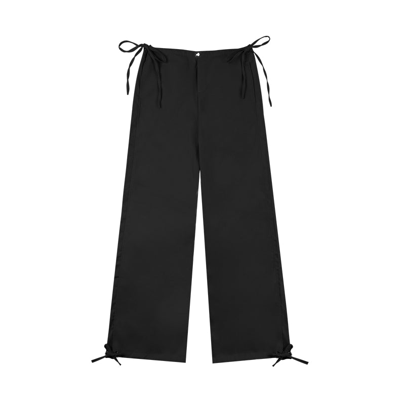 Black wide-leg pants with tie details on a white background