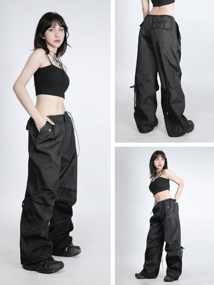 Woman wearing black cargo pants with multiple angles shown on a white background