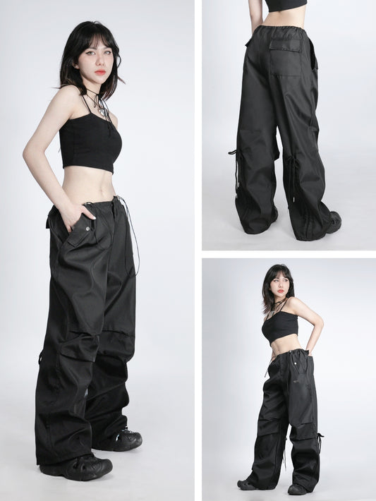 Woman wearing black cargo pants with multiple angles shown on a white background