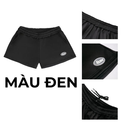 Black shorts with brand logo on a white background, labeled 'M u Den'.