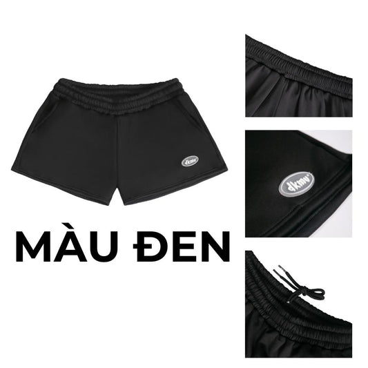 Black shorts with brand logo on a white background, labeled 'M u Den'.