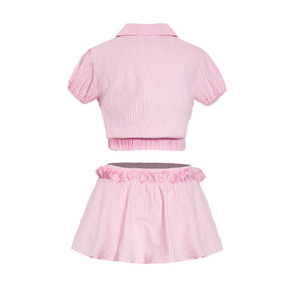Pink striped crop top and skirt set on a white background