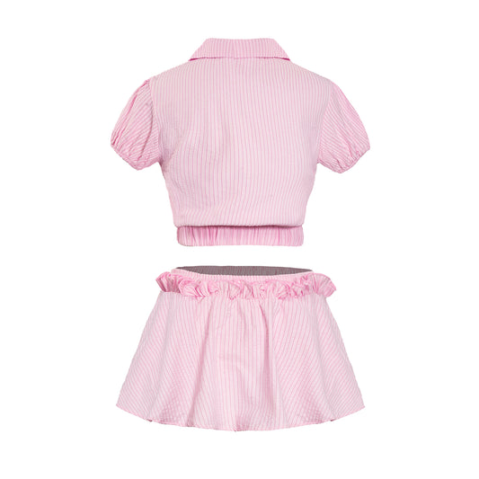 Pink striped crop top and skirt set on a white background
