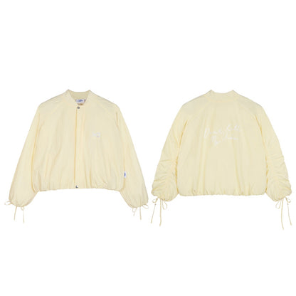 Two cream-colored jackets on a white background