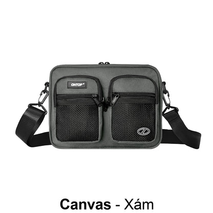 Gray crossbody bag with visible brand logo on a white background