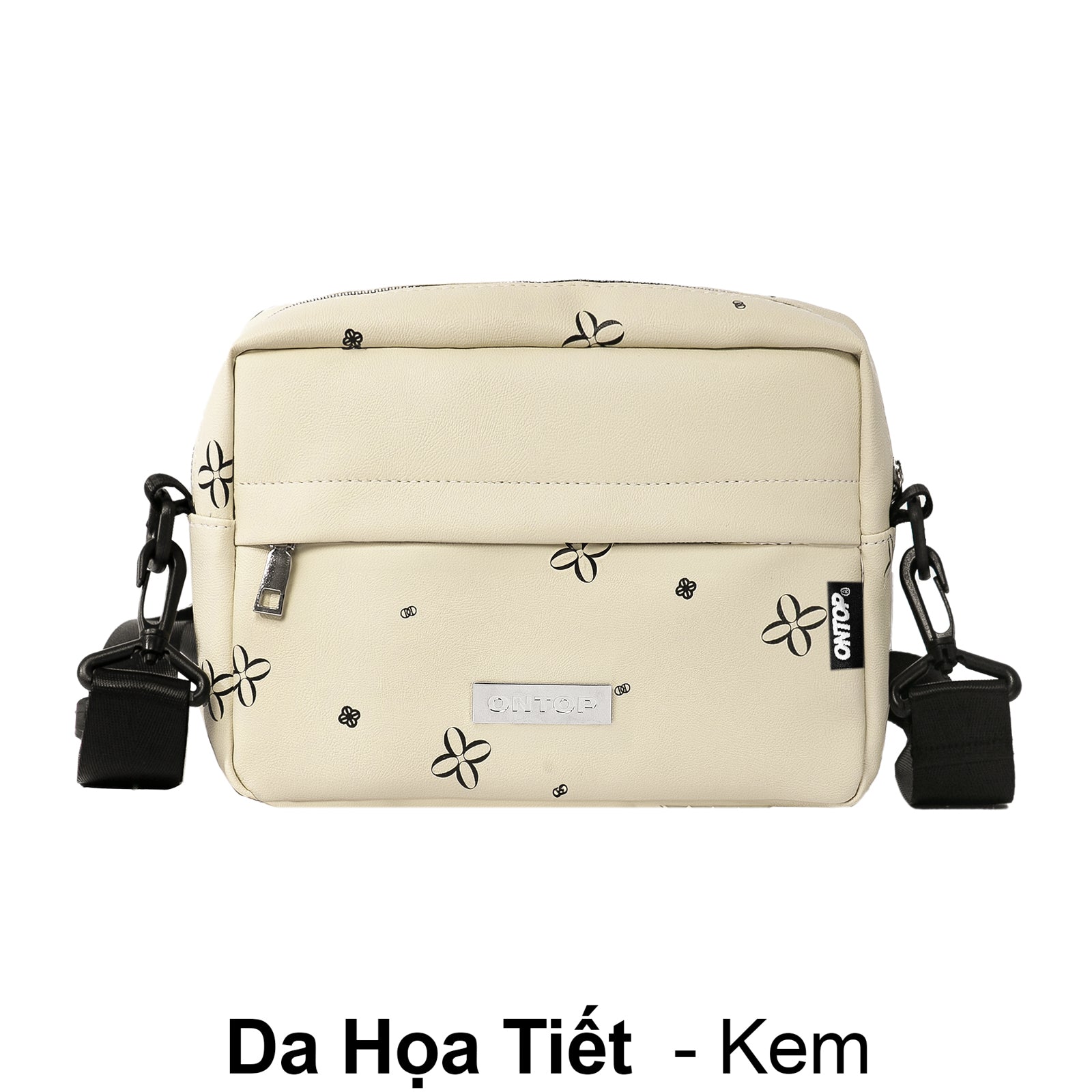 Beige handbag with black floral patterns on a white background