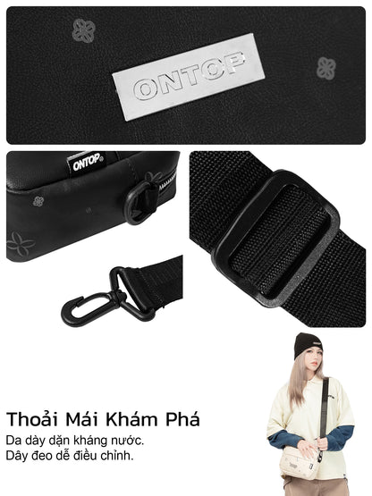 Black strap with carabiner and ONTOP branding, featuring a person carrying a bag.