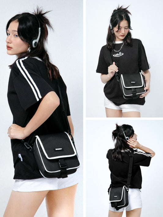 Woman wearing a black bag with white accents in various poses on a white background