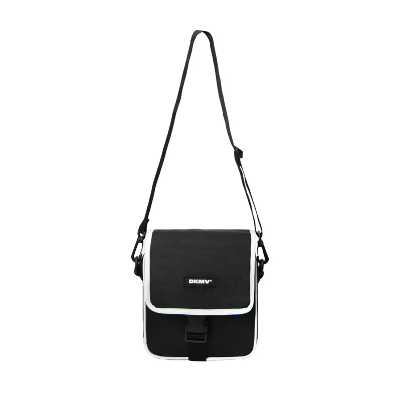 Black and white shoulder bag with 'DKNY' logo on a white background