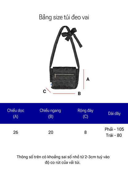Black crossbody bag with measurements on a white background