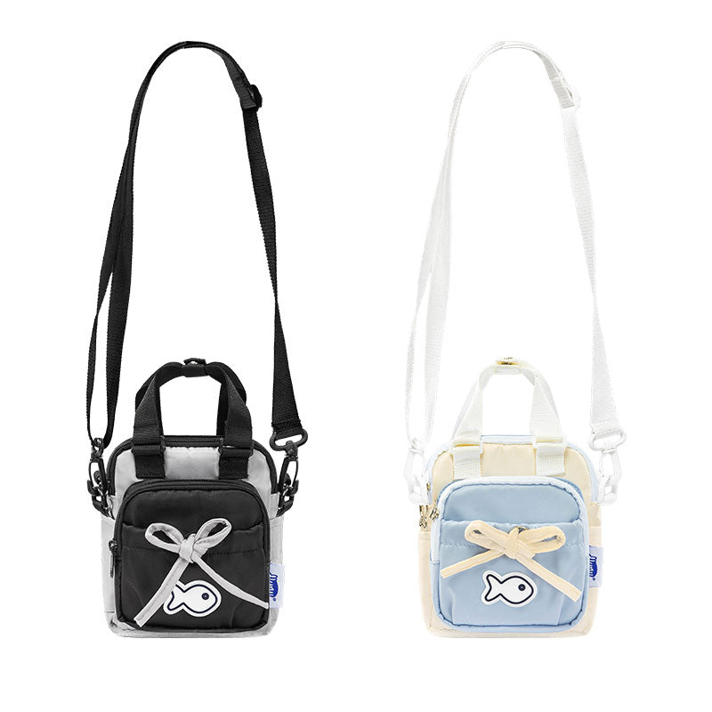 Two small bags, one black and one light blue, with decorative elements on a white background.