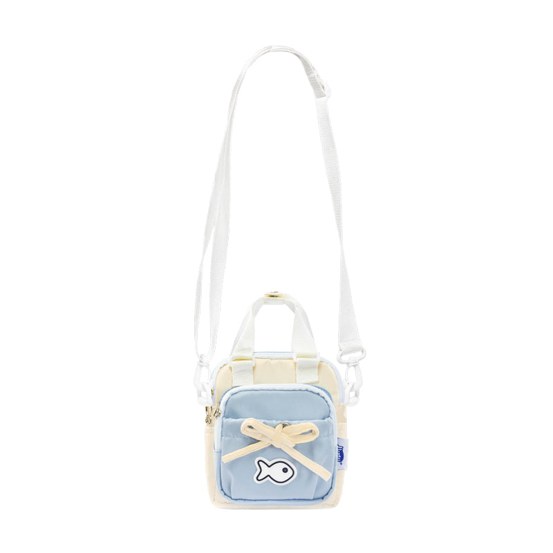 Small crossbody bag with a light blue front panel and white strap on a white background