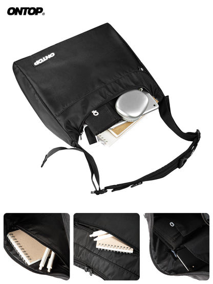 Black bag with a shoulder strap, containing stationery items, on a white background.