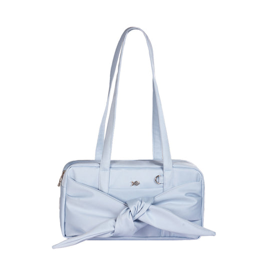Light blue handbag with a bow detail on a white background