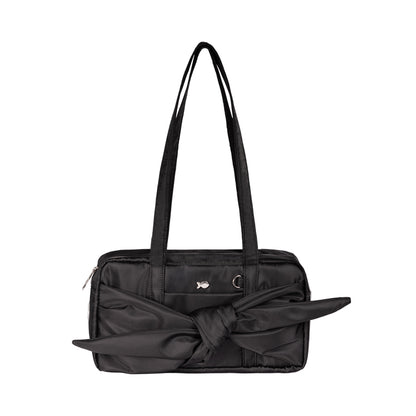 Black handbag with a large bow on a white background
