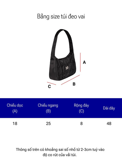 Black shoulder bag with measurement chart on a white background