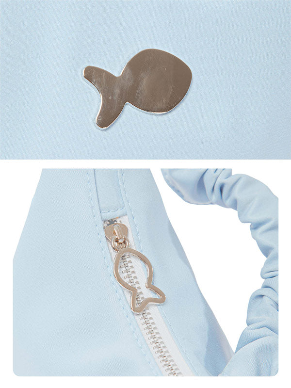 Light blue jacket with fish-shaped zipper pull on a light blue background
