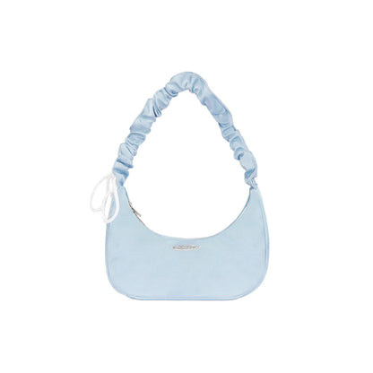 Light blue handbag with ruched strap on a white background
