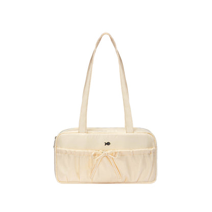 Beige handbag with a bow on a white background