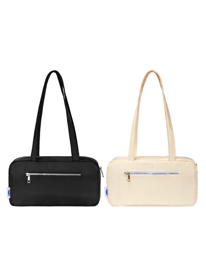 Black and beige handbags with zippers on a white background