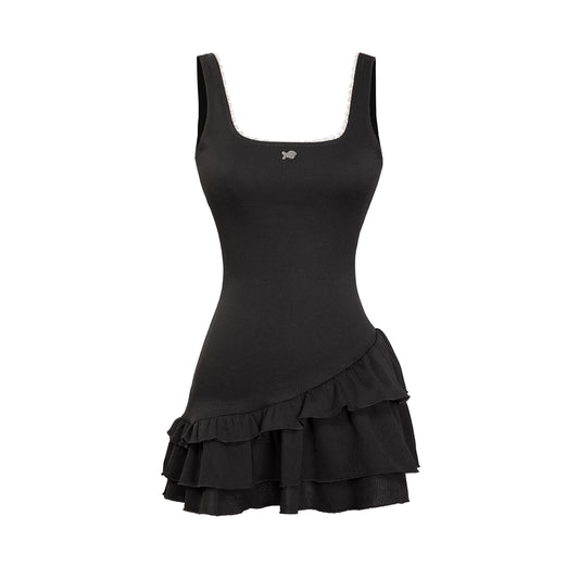Black dress with ruffled skirt on a white background