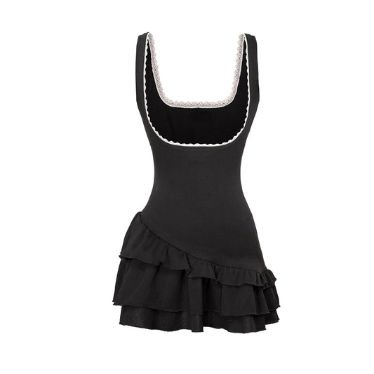 Black dress with white lace trim on a white background