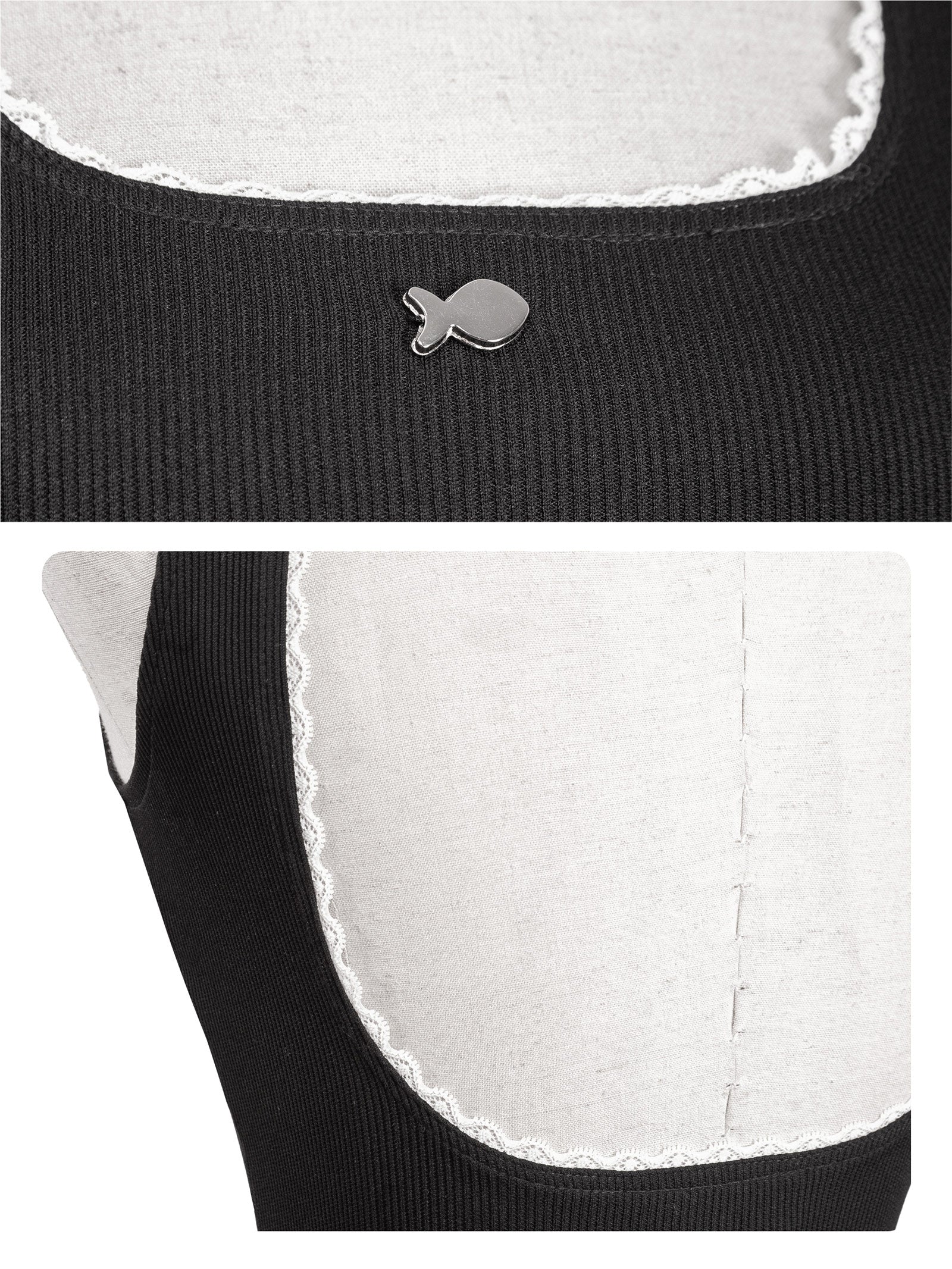 Close-up of a black garment with white lace trim and a small fish-shaped button.