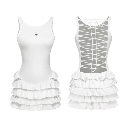 White tank top with ruffled skirt and lace-up back design on a white background