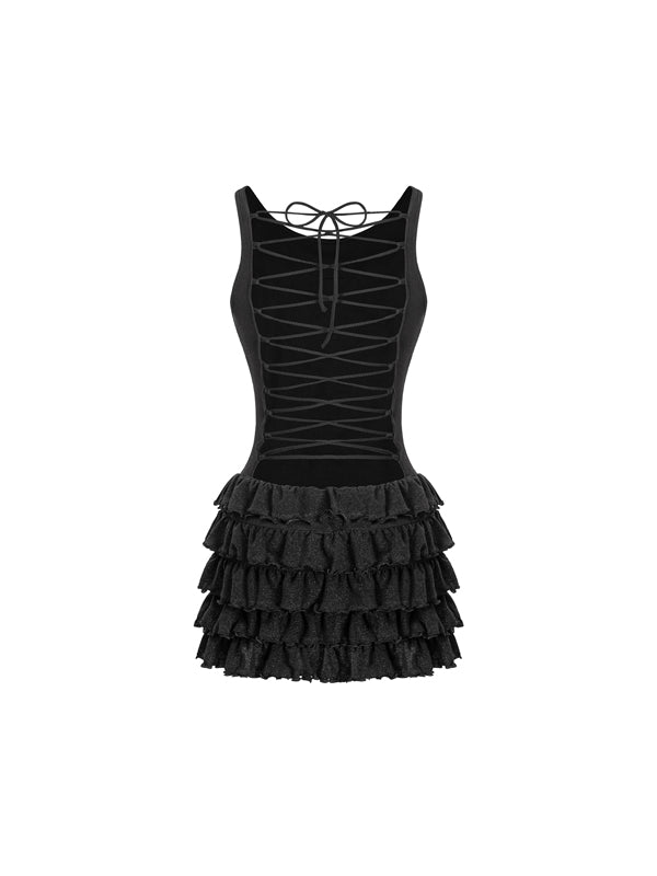 Black dress with tiered ruffle skirt on a white background