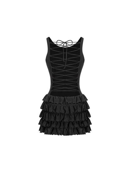 Black dress with tiered ruffle skirt on a white background