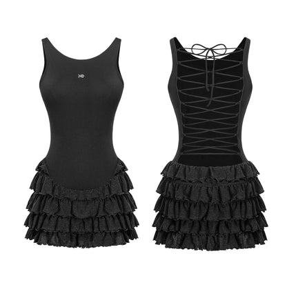 Two black dresses with ruffled skirts on a white background