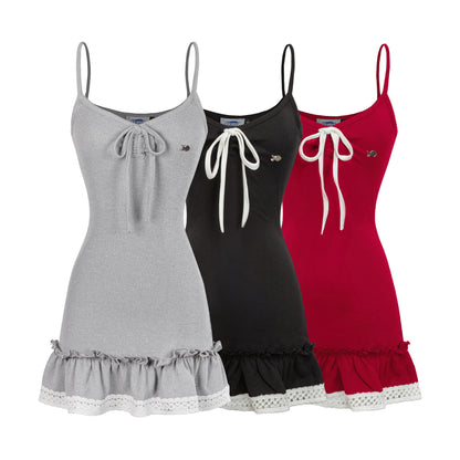 Three dresses in gray, black, and red with lace trim on a white background