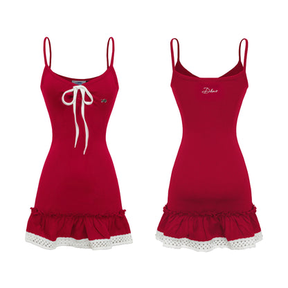 Red dress with white lace trim on a white background