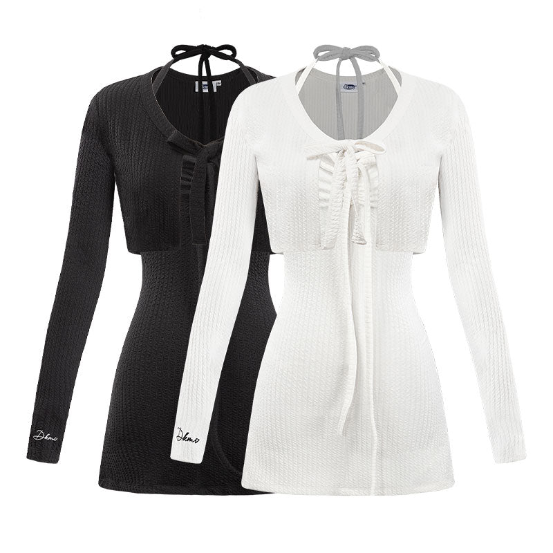 Black and white long-sleeve tops on hangers with visible brand names.